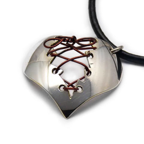 Handmade silver stitch heart spoon pendant made in Noosa